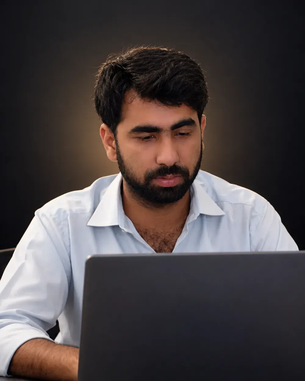Mustafa Khan, Etsy seller and BWOK Batch 1 student, at a laptop